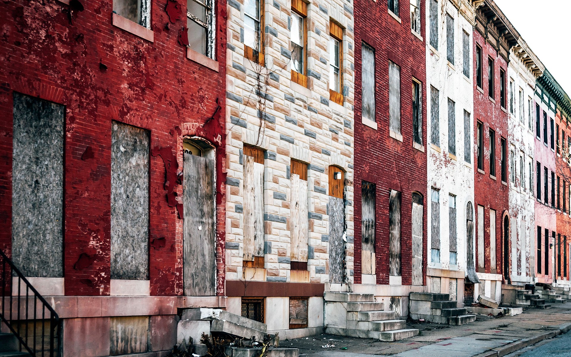 Boarded up inner city homes. West Baltimore, Maryland.
